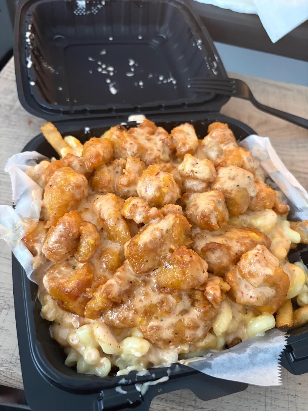 Crazy fries with chicken and mac and cheese photographed by a guest