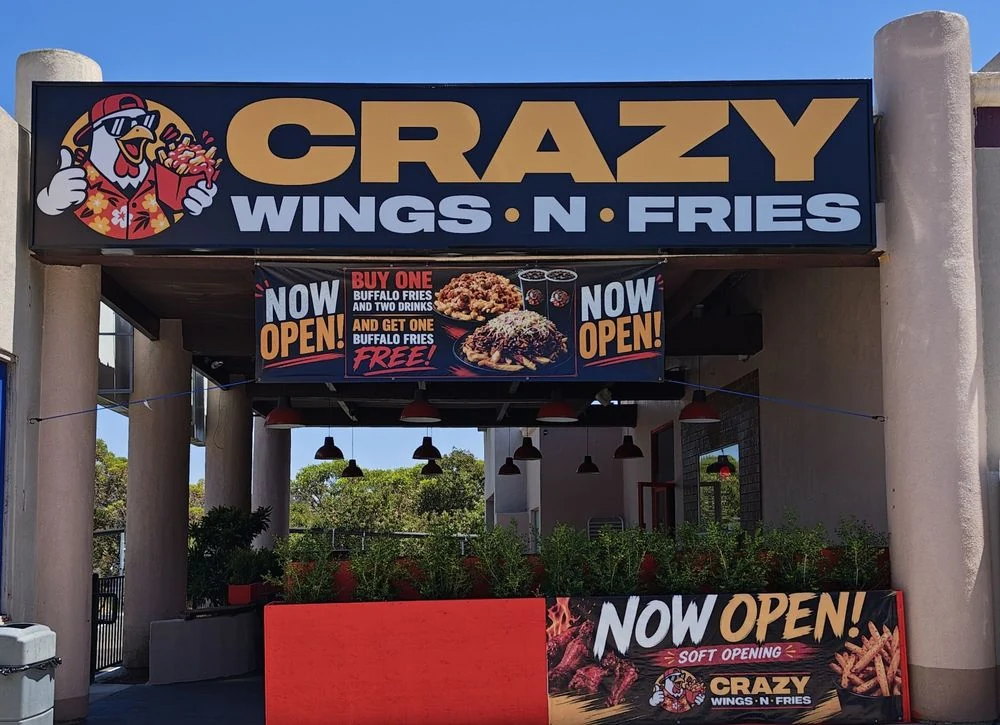 Crazy Wings N Fries entrance with its chicken logo and restaurant sign